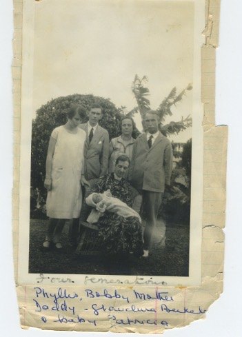 Four generations: Phyllis, Bobby, Ursula and John Thomas standing; Grandma Berkeley seated holding baby Patricia